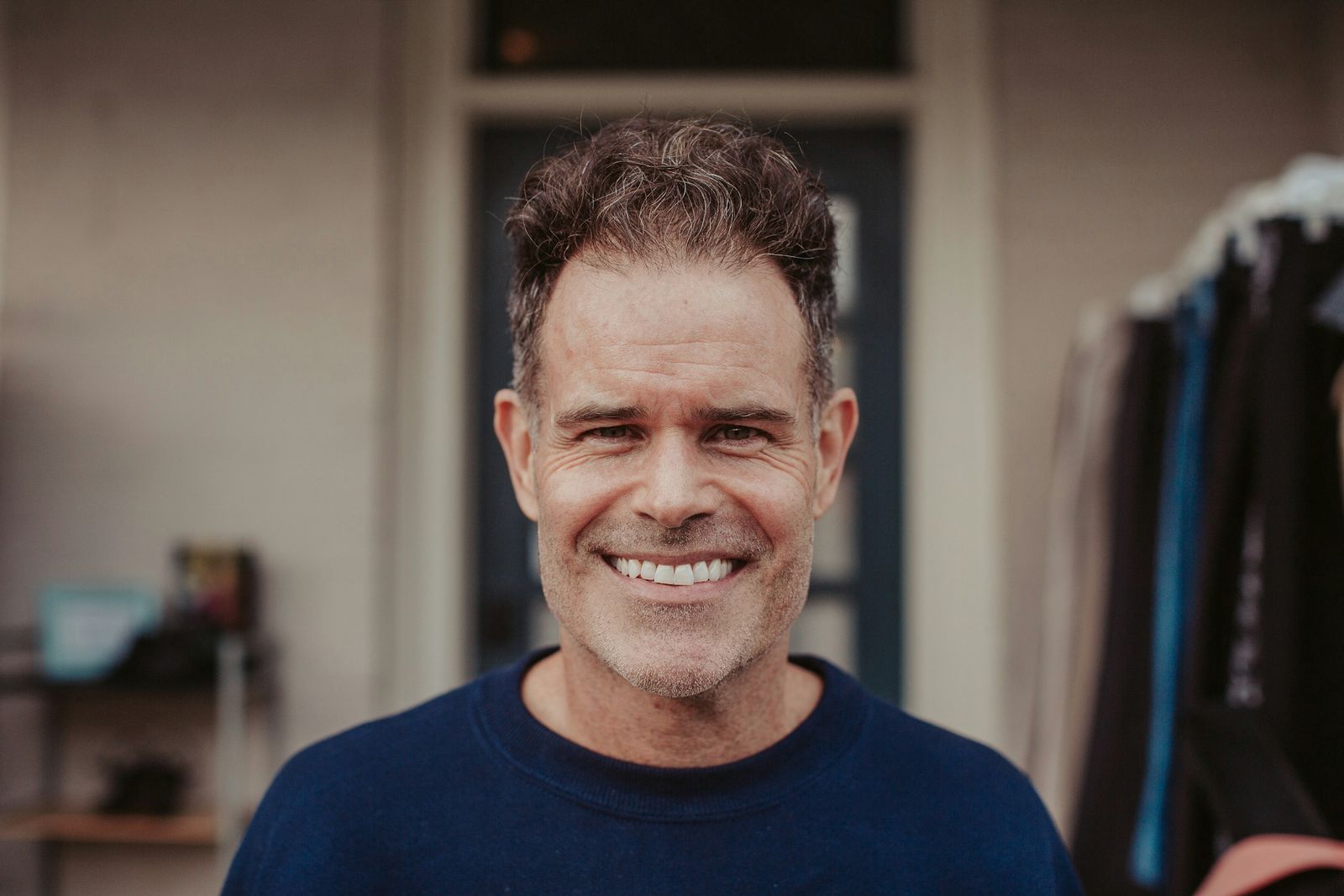 Smiling man in his late 40s with a confident smile