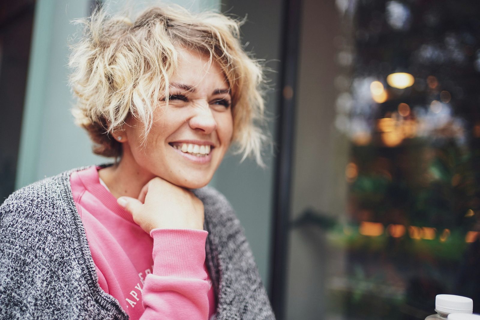 Smiling woman with curly blonde hair