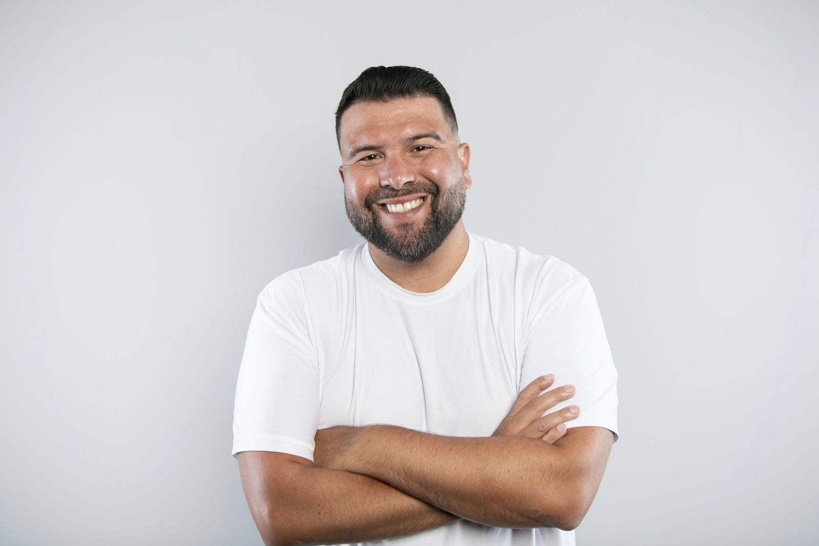 Man in his 40s with a big, confident smile